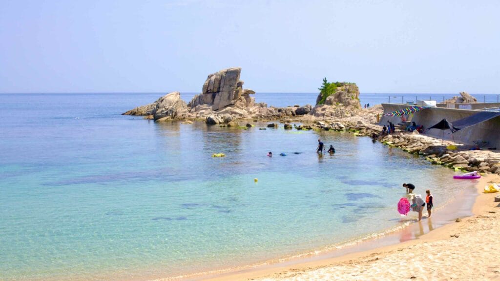 Gonghyeonjin Beach near Gonghyeonjin Port captivates with its sand and crystal-clear waters, where visitors enjoy wading and snorkeling.