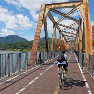 A rider crosses the Bukhangang Bridge on the Hangang Bicycle path in Korea.