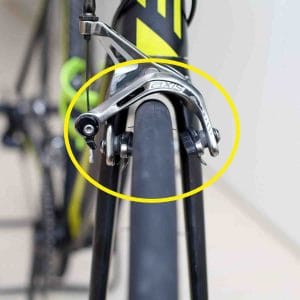 A picture of brake misaligned calipers on a bicycle.