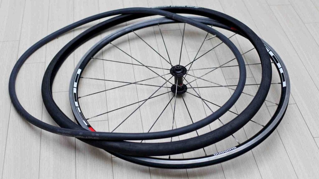 A picture of a bicycle's clincher style wheel:, including its tire and tube.