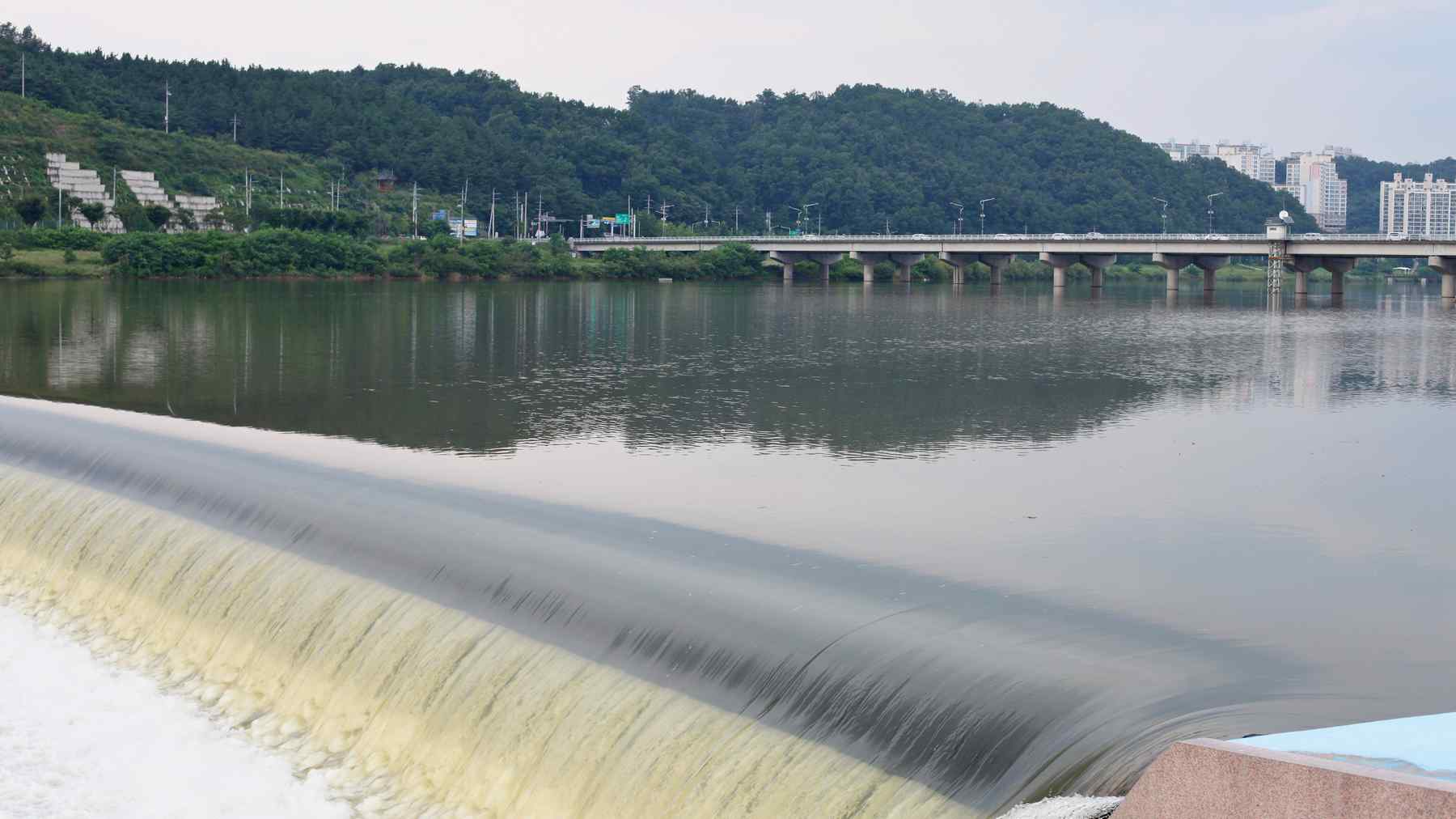 A picture a low head dam smoothing out the Nakdong River's flow in downtown Andong City.