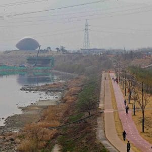 A picture of a bike path near The ARC Cultural Center (디아크문화관) on the western edge of downtown Daegu City.