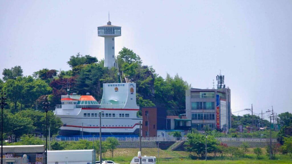 The Ganggyeong Salted Seafood Exhibition Hall, shaped like a ship, sits at near Hwangsan Neighborhood Park.