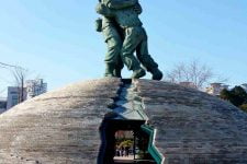 The dome and two soldiers embracing at the War Memorial of Korea symbolizes the North/South Korean split.