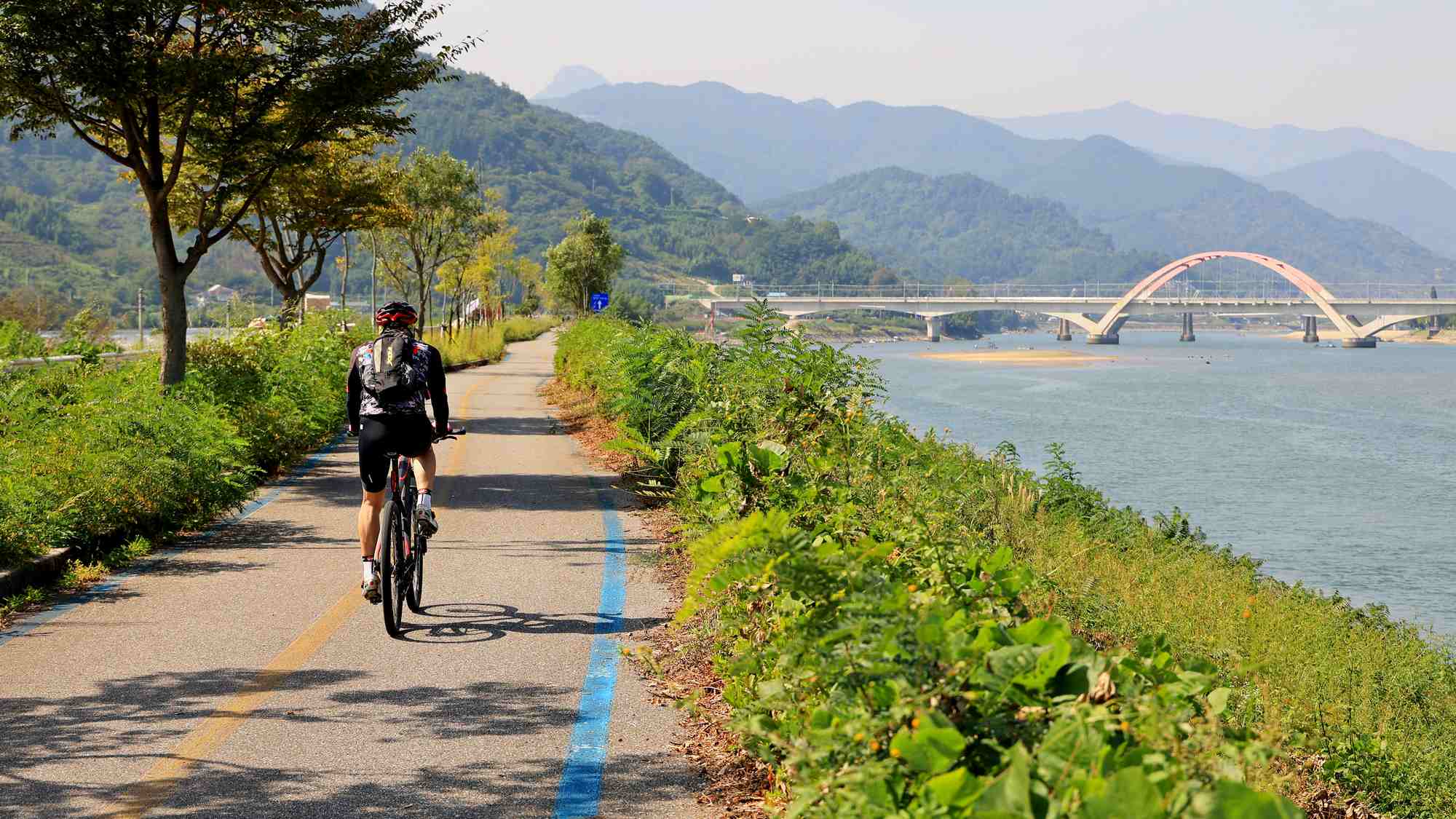 Seomjingang Bike Path - Gokseong Gwangyang - Biker near Railroad Bridge in Gwangyang