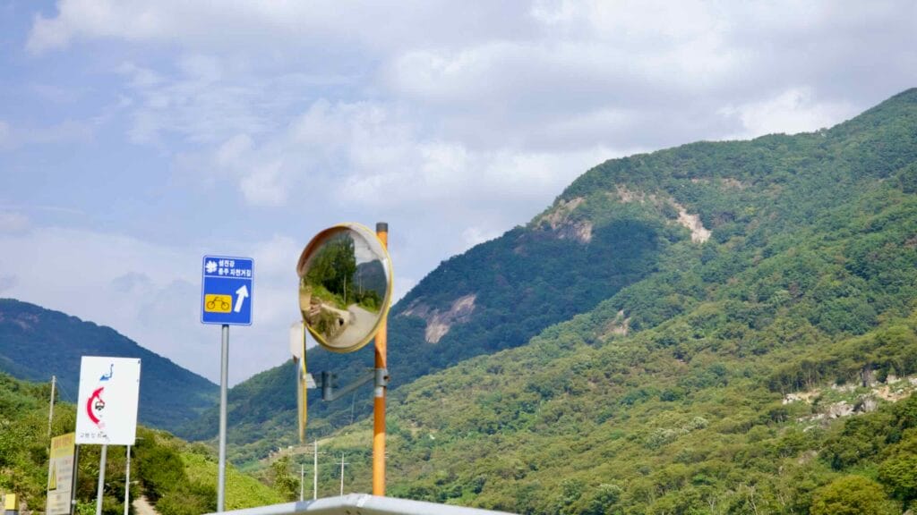 A Seomjingang Bike Path sign marks the cycling route.