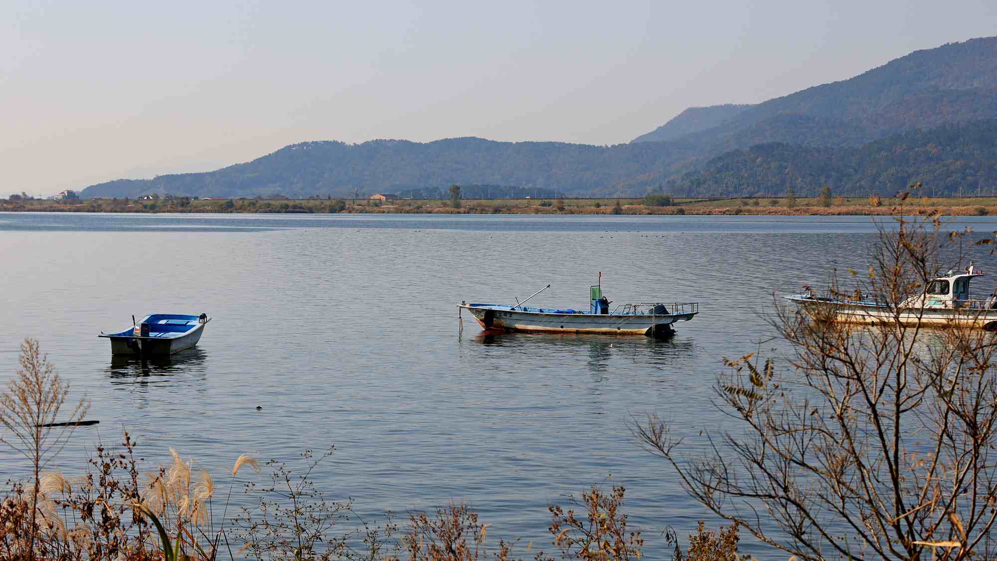 A picture of a small boat bobbing on the Nakdong River near Busan along the Nakdonggang Bike Path.