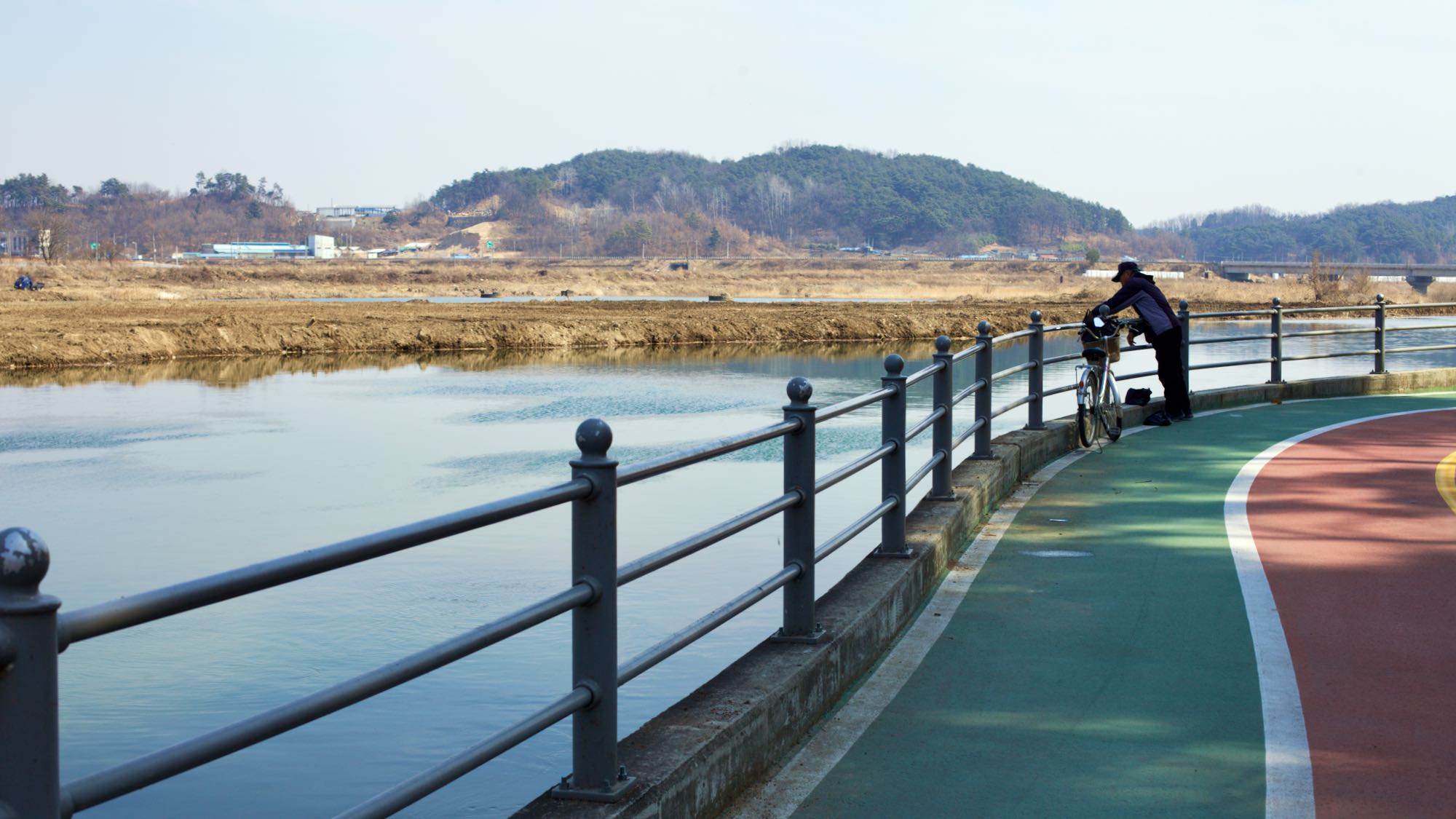A picture a rider and the bike path near the Jeomchon Neighborhoods on the Saejae Bicycle Path (새재자전거길) in Mungyeong City (문경시), South Korea.