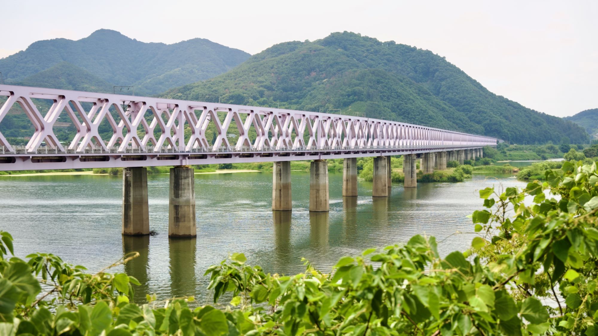 A picture of the Nakdong River Railroad Bridge (낙동강철교) crossing the Nakdong River (낙동강) on the Nakdonggang Bike Path (낙동강자전거길) between in Miryang and Gimhae Cities, in South Korea.