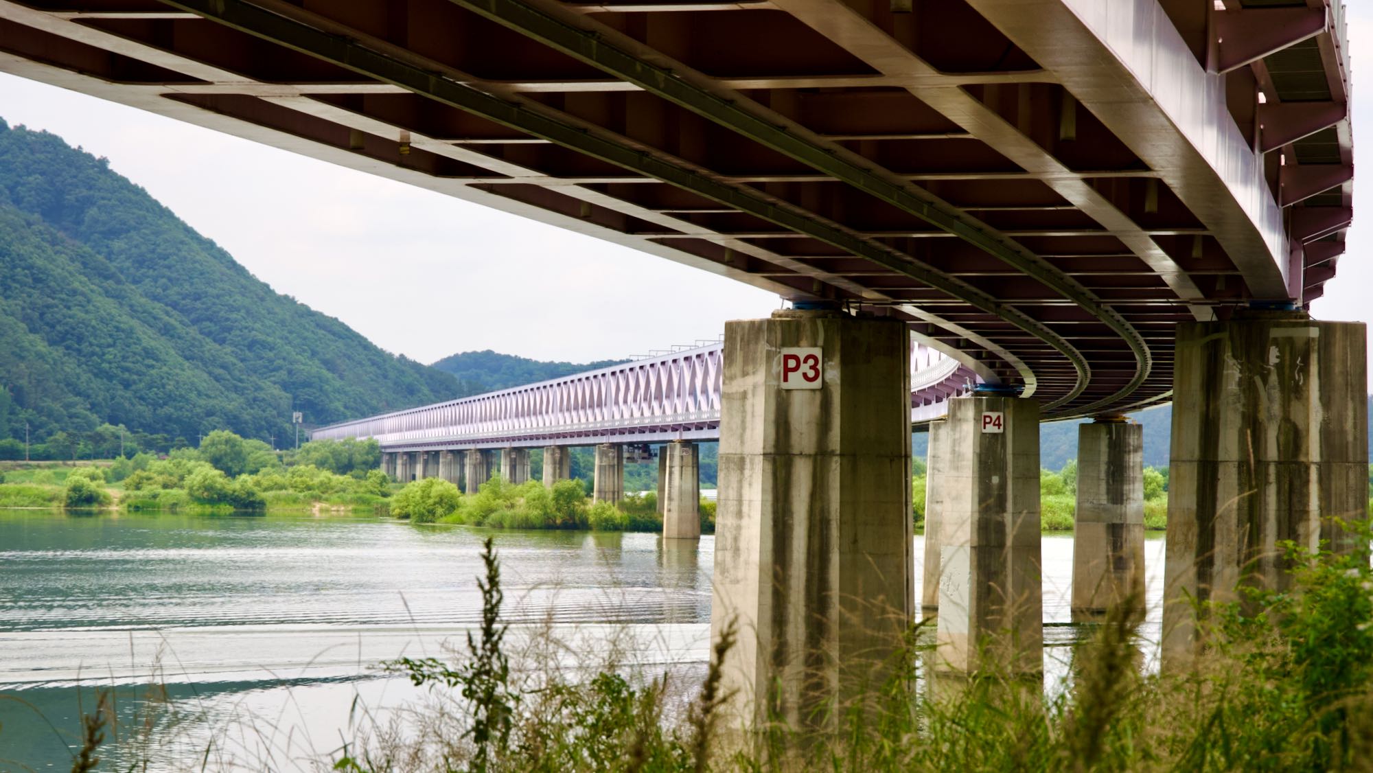 A picture of the Nakdong River Railroad Bridge (낙동강철교) on the Nakdonggang Bike Path (낙동강자전거길) along the Nakdong River (낙동강) in Gimhae City, in South Korea.