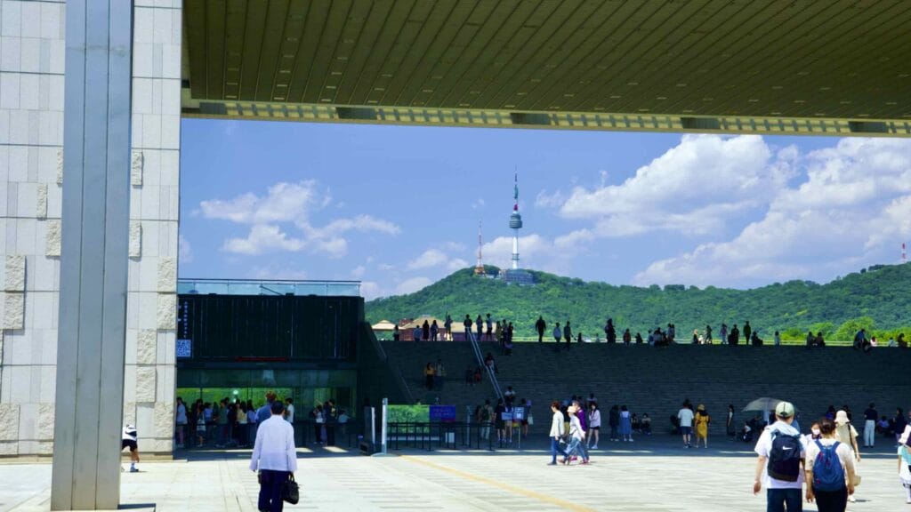 A picture of Namsan Seoul Tower (남산서울타워) on top of Nam Mountain (남산) as seen through the National Museum of Korea in Seoul, South Korea.