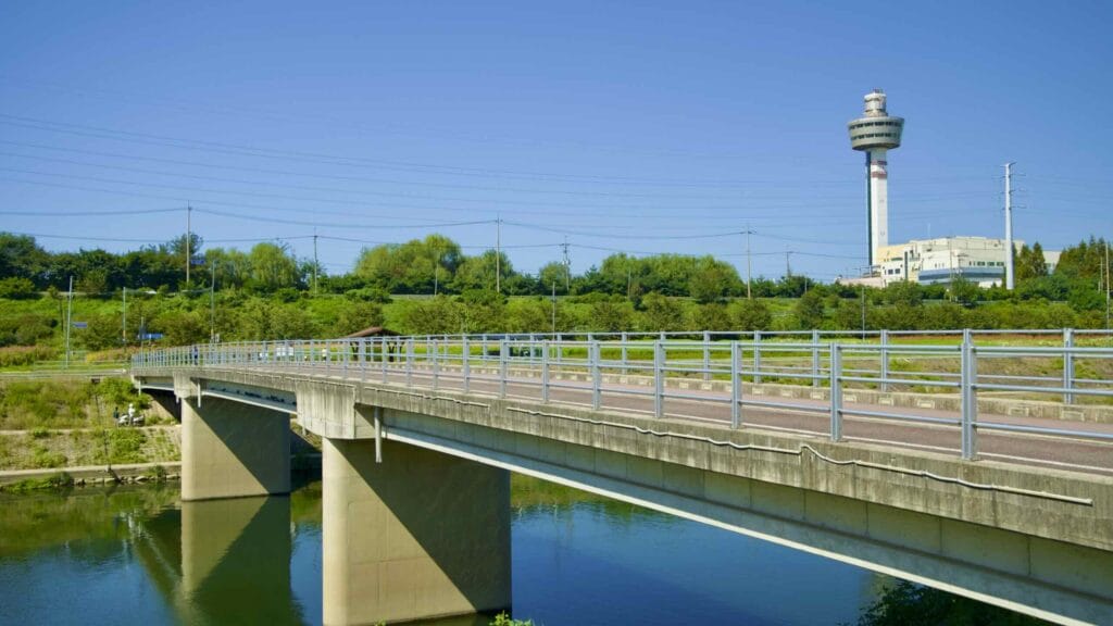A picture of Guri Tower and Wangsuk Stream (왕숙천) on the Hangang Bike Path (한강 자전거길) in Guri City (구리시) South, Korea.