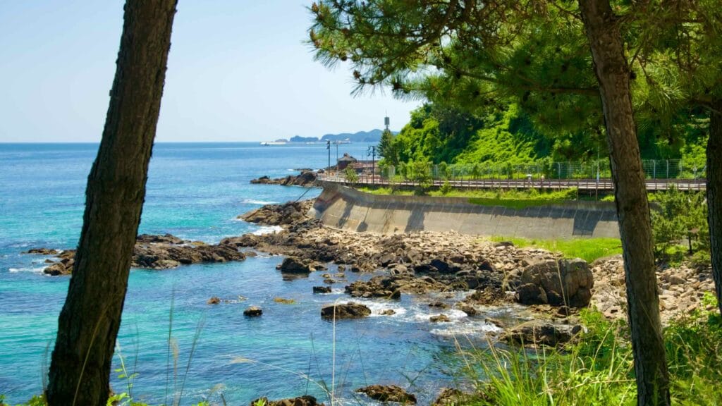 A view of the rocky coastline and clear blue waters of the East Sea as seen from Isabu Road.