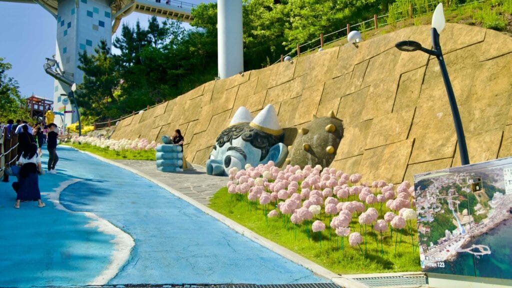 The goblin statue greets visitors at the entrance path of Dojebigol Sky Valley.