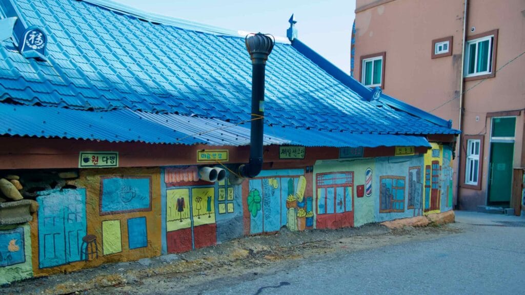 Murals adorn the walls near the entrance to Lighthouse Road on Nongoldam Street.