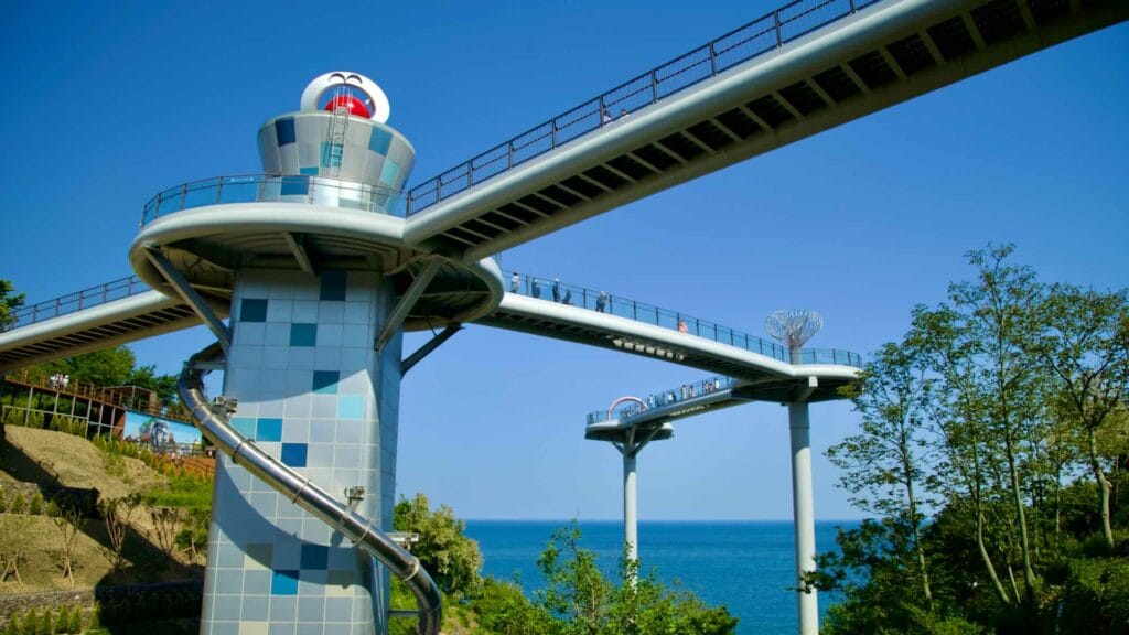The skywalk and spiral slide at Dojebigol Sky Valley offer visitors a thrilling experience and stunning views of the East Sea.