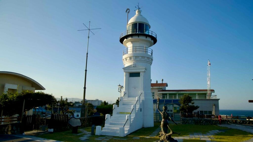 Jumunjin Lighthouse stands over the coast north of Jumunjin Port.