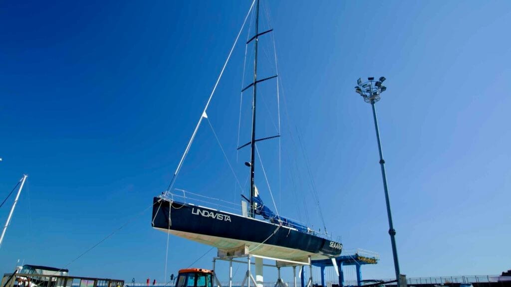 The Yangyang Susan Port Yacht Club Building, showcasing modern architecture and surrounded by lush greenery under a bright, sunny sky.
