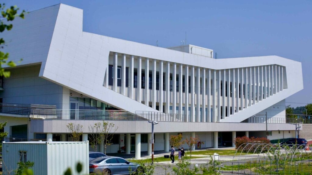 The Gunsan City Lifelong Learning Center for Developmental Disabilities features a striking modern