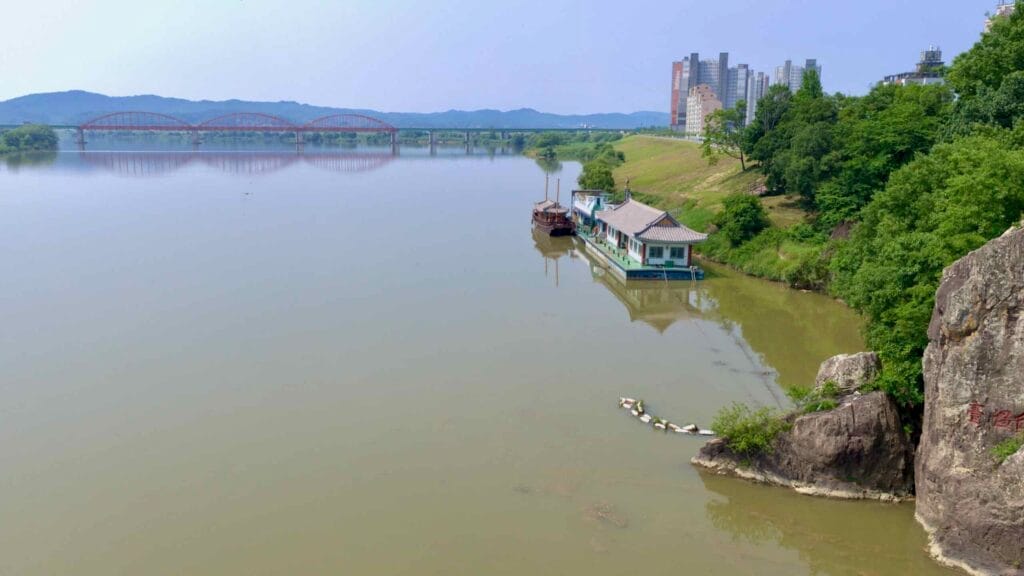 Jaondae Rock, inscribed with historic Chinese characters, stands prominently along the Baengma River.