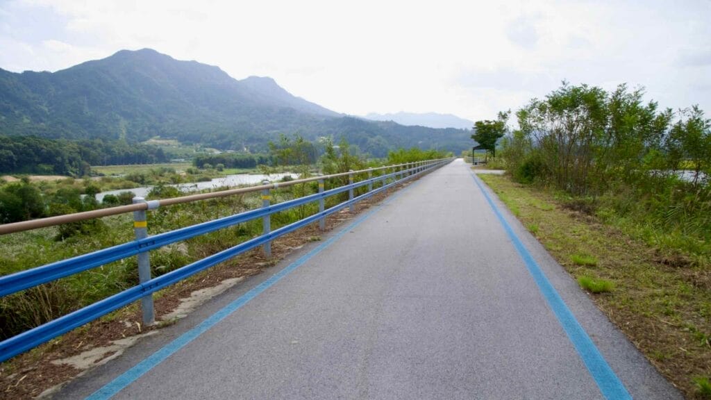Well-maintained Seomjingang Bike Path runs parallel to the river, offering scenic mountain views.