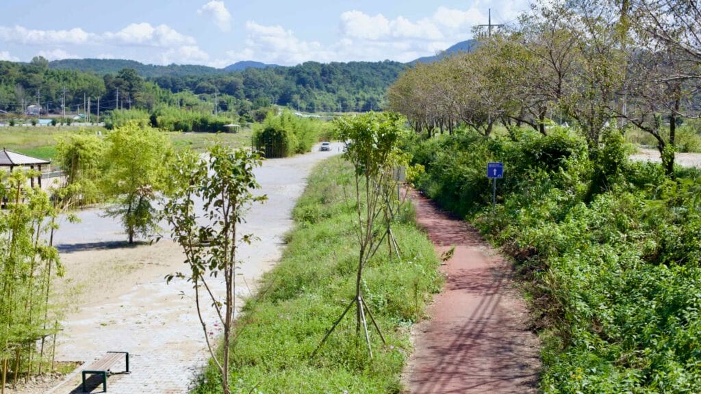 Red-paved cycling path winds through the rural countryside along the Bike Path.