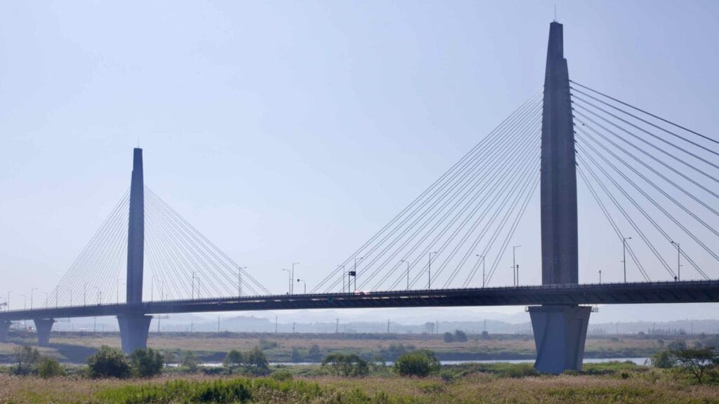 The modern cable-stayed Bitgaram Bridge stretches across the Yeongsangang River, with its towering