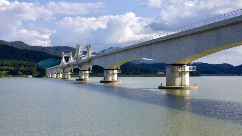 Modern bridge with intricate supports stretches across the Yeongsangang River.
