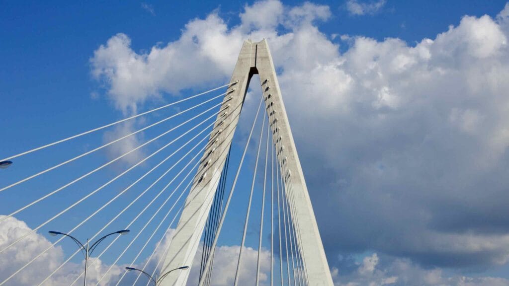 A dramatic view of Namchang Bridge’s towering cable-stayed structure, with its suspension cables
