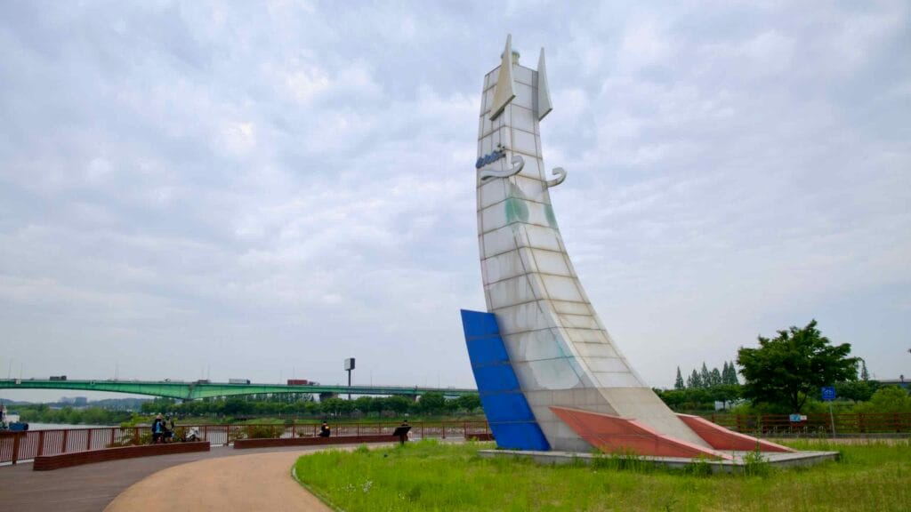 A sail-like sculpture rises along the Ara Bicycle Path at Duri Ecological Park.