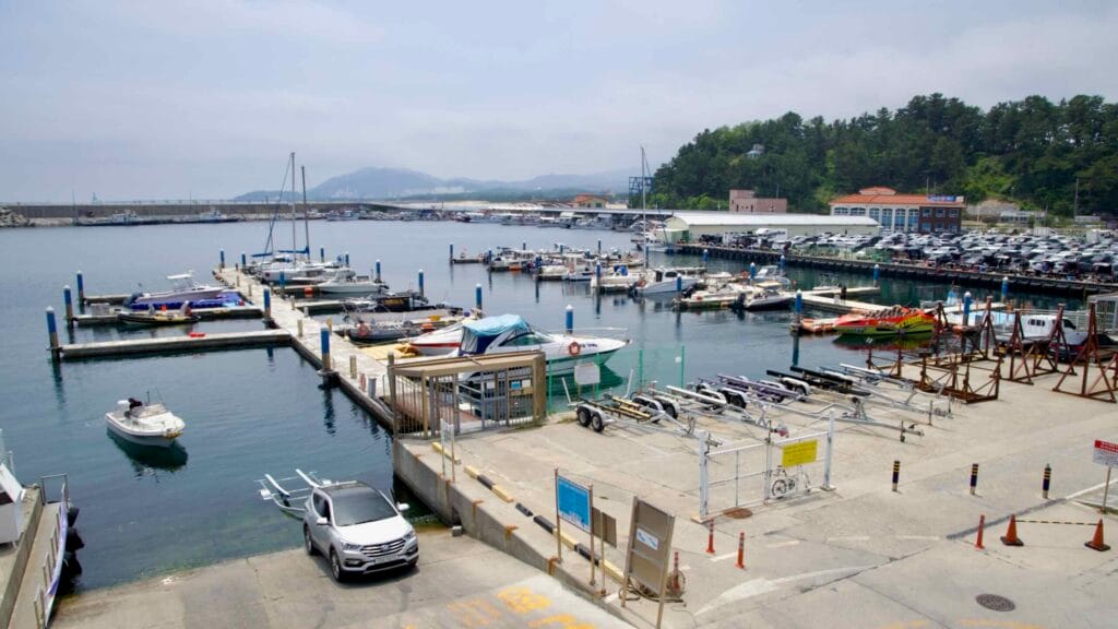 A cluster of small boats and yachts in the marina at Gangneung Port.