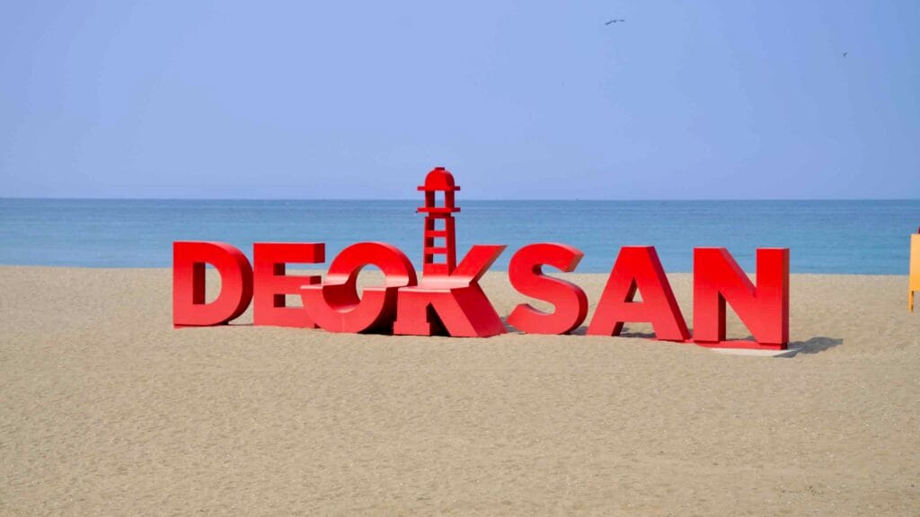 A “DEOKSAN” sign on Deoksan Beach.