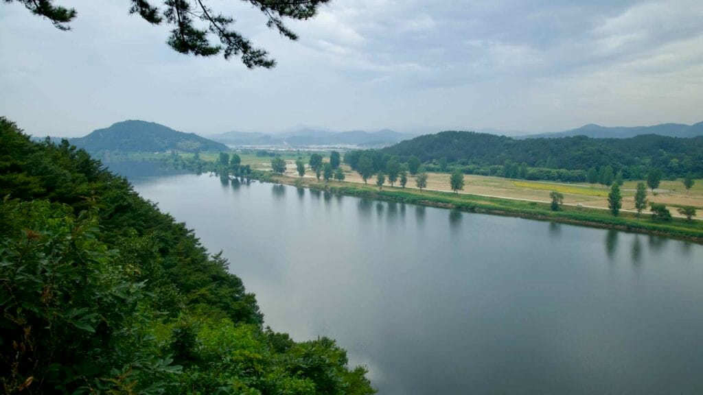 Geum River winds through hills and farmland, seen from near Nakwaam Rock.