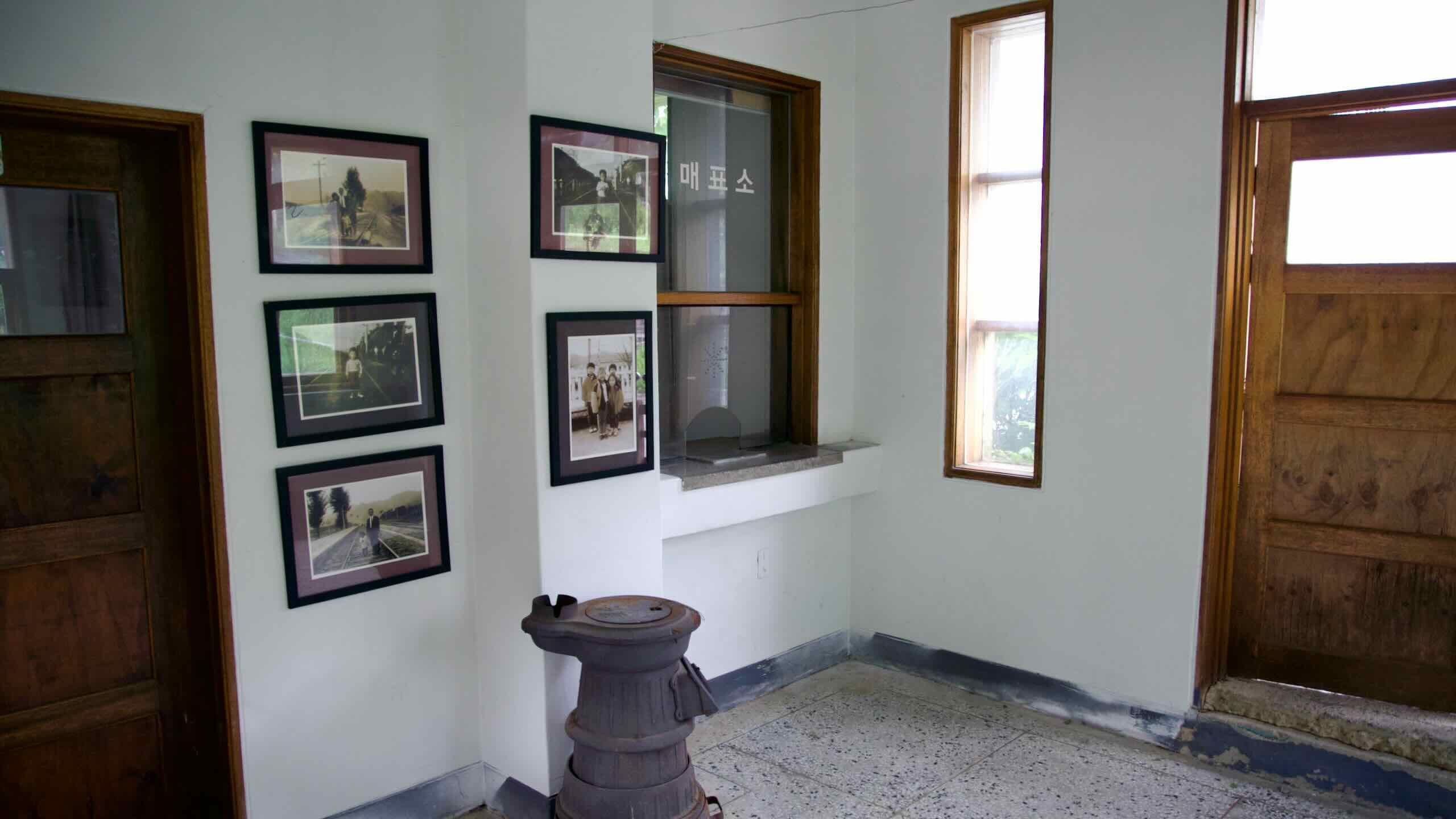 Inside Neungnae Station, old photographs and a cast-iron stove preserve the atmosphere of this once-active train stop on the Gyeongchun Line.