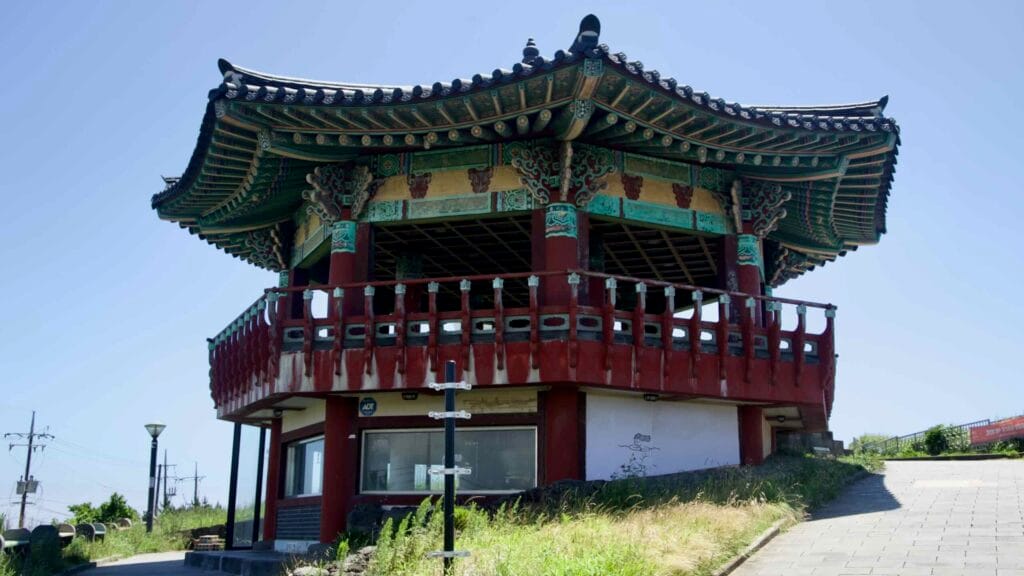 Suwol Pavilion crowns Suwolbong with dancheong eaves and coastal views.
