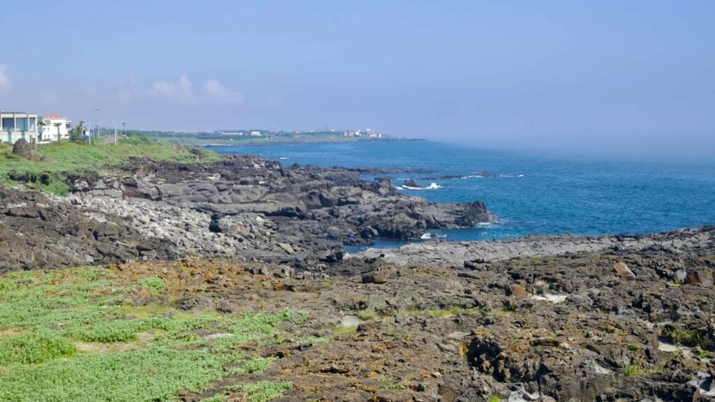 Layered lava ledges and coves along Jeju’s rugged west coast.
