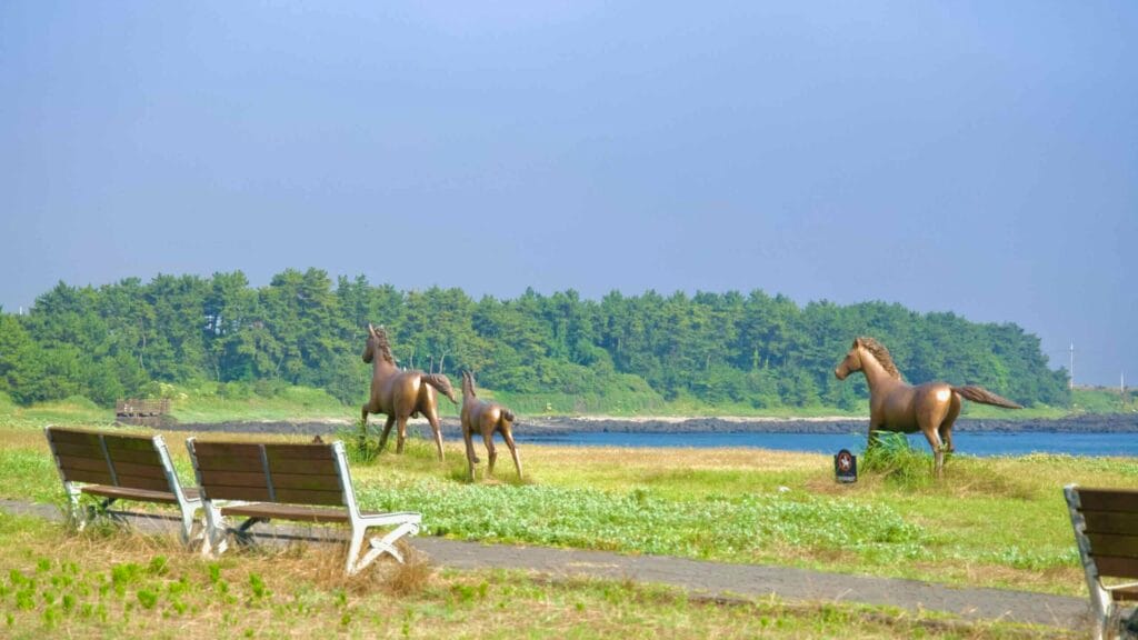 Bronze horse statues in a seaside park near Daejeong.