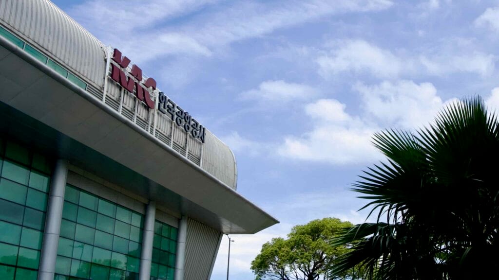 Jeju International Airport facade with KAC logo and glass curtain wall.