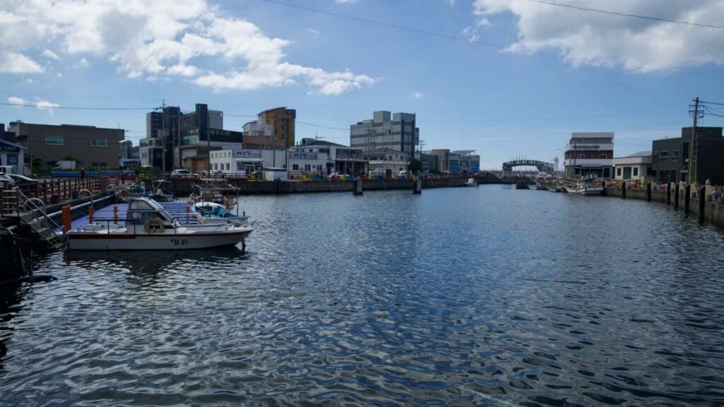 Fishing boats along Gueom Port channel.