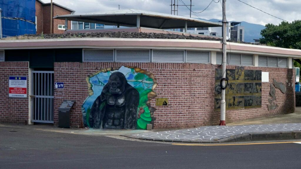 Gorilla mural on a waterfront restroom near Gueom Port.