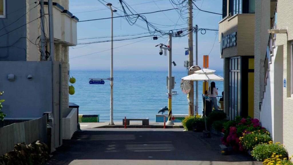Side street dropping to Iho Tewoo Beach and the sea.