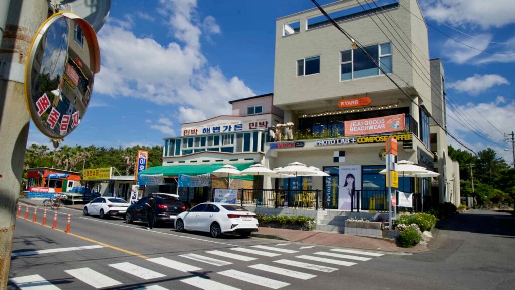 Storefronts and cafés beside Iho Tewoo Beach.