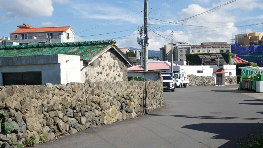 Basalt walls and old stone houses along a quiet lane.
