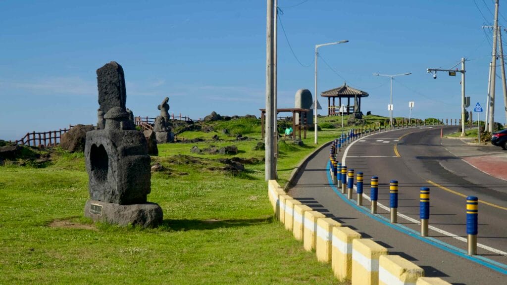 Bike lane climbs along the Hagu‑Aewol Coastal Road at Darak Shelter.