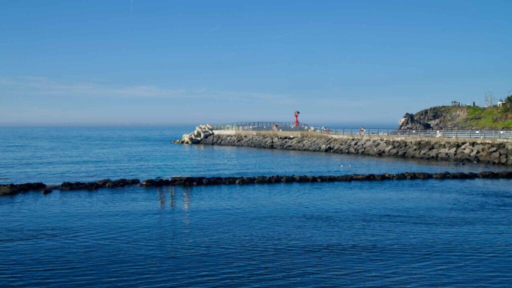 Close view of the outer breakwater at Gonae Port, with tetrapods.