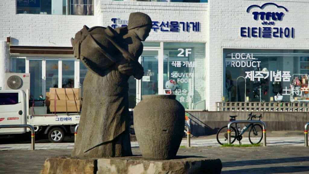 The Jeju Woman with a Water Jar statue stands near Aewol Handam Park.