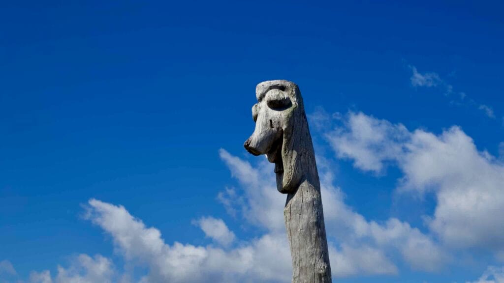 Weathered wooden totem at the waterfront near Hanlim.
