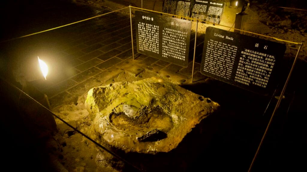 ‘Living Rock’ display with information boards inside Hallim Park lava cave.