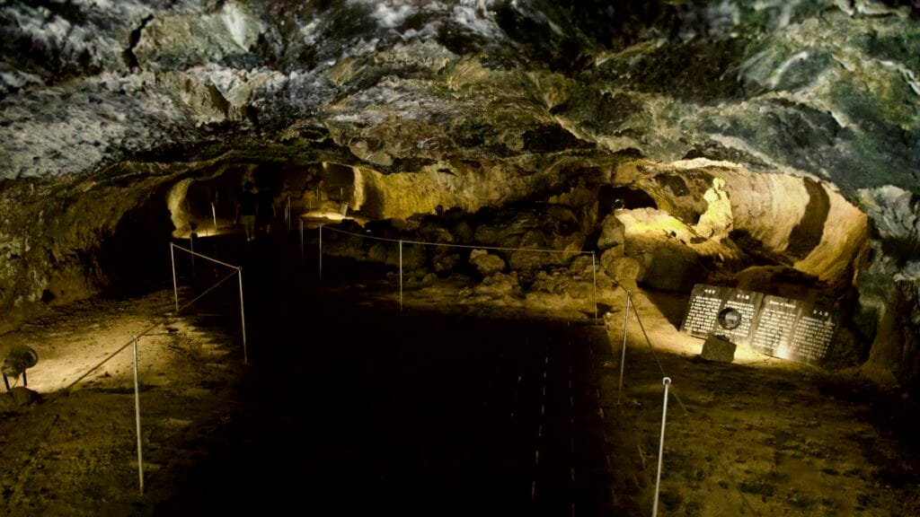 Walkway with interpretive signs inside the Hallim Park lava cave.