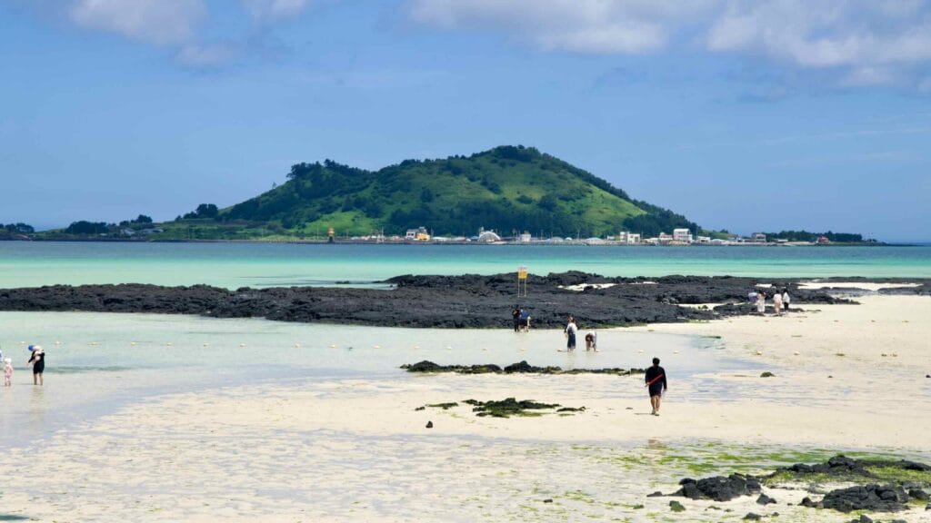 Hyeopjae Beach with Biyangdo Island and turquoise water.